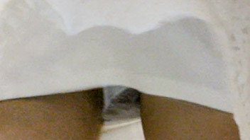 Ut_2668# Stunning brunette cutie in white miniskirt. Our operator filmed her round butt and clean sh