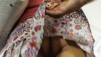 Ut_2221# Sleder girl in short colored skirt. The cameraman was raising lap of her skirt few times ma