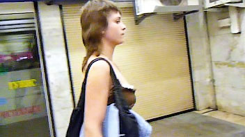 Ut_0891# A girl in a brown tunic! She stood very calmly at the escalator. I used this moment and wit