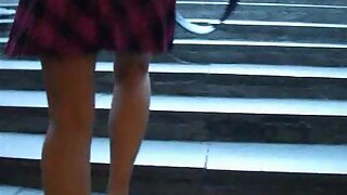 UT_759#It was a pretty lady in a short checked skirt. She was in hurry and talk on the phone